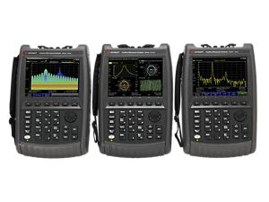 Three FieldFox handheld analyzers showing a real-time spectrum analysis measurement, a four window display S-parameter measurement, and a distance to fault measurement